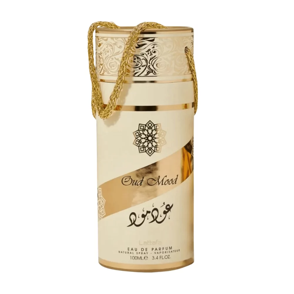 Lattafa Oud Mood Edp Unisex 100Ml Bottle With A Warm, Luxurious Background, Highlighting Oud And Caramel Notes.