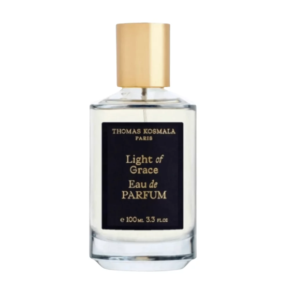 Thomas Kosmala Light Of Grace Edp 100Ml Bottle With A Soft Floral Background, Highlighting White Flowers And Amber Notes.